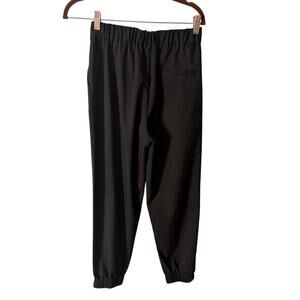 Mo&Co. Black Tailored Jogger Pants S‎ Pleated Tapered Elastic Cuff Minimalist